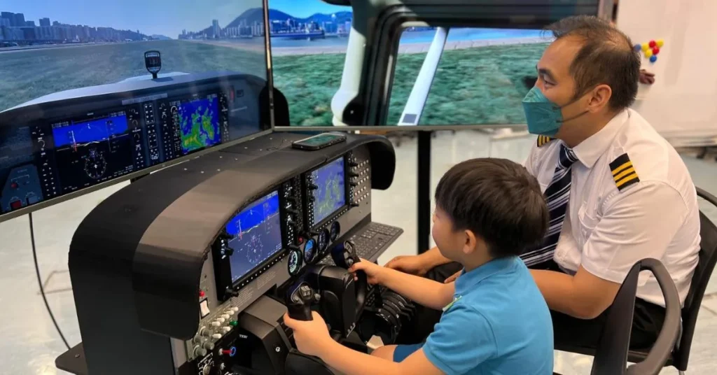 a person is playing with an airplane simulator