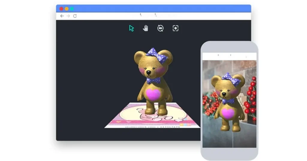 A teddy bear hologram with a bow displayed on a computer screen and a mobile phone screen within an augmented reality setting.