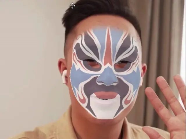 an asian man with ar face mask filter