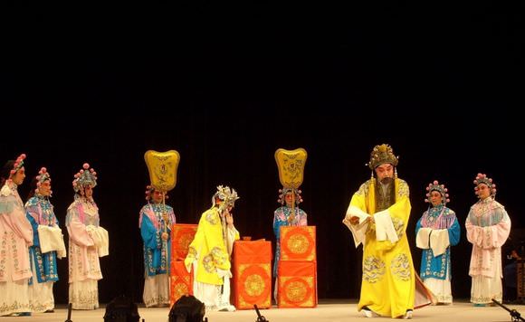 a group of people dressed in traditional chinese costumes on stage