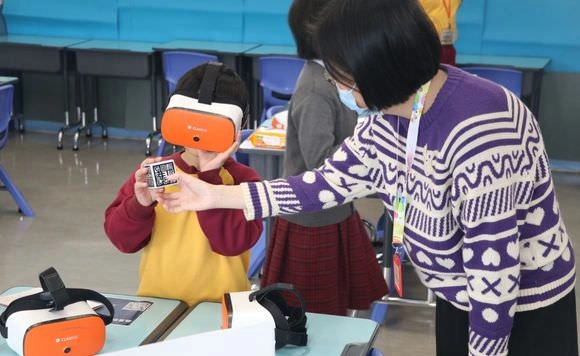 A person is showing a child how to use a virtual reality headset